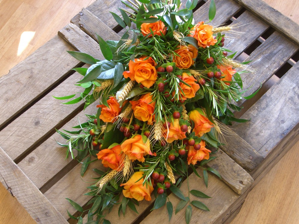 Autumn rose tied funeral sheaf